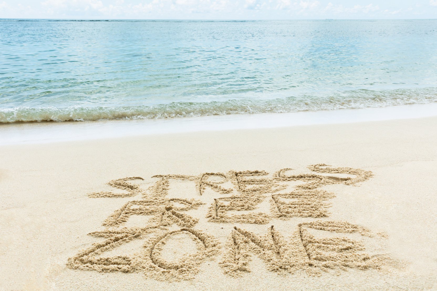 Stress Free Zone Written On Sand At Beach